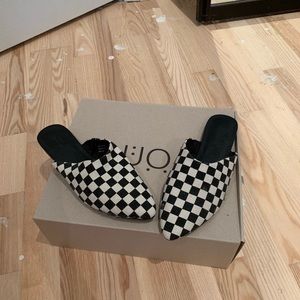 Slip on checkered shoes.